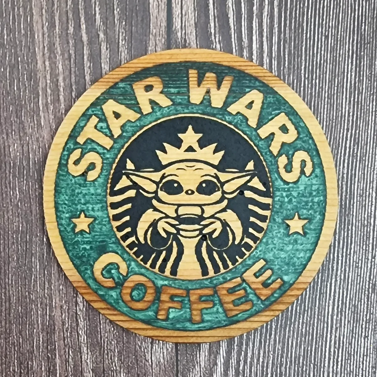 Star Wars coffee coaster with an engraved Baby Yoda design, hand-painted green