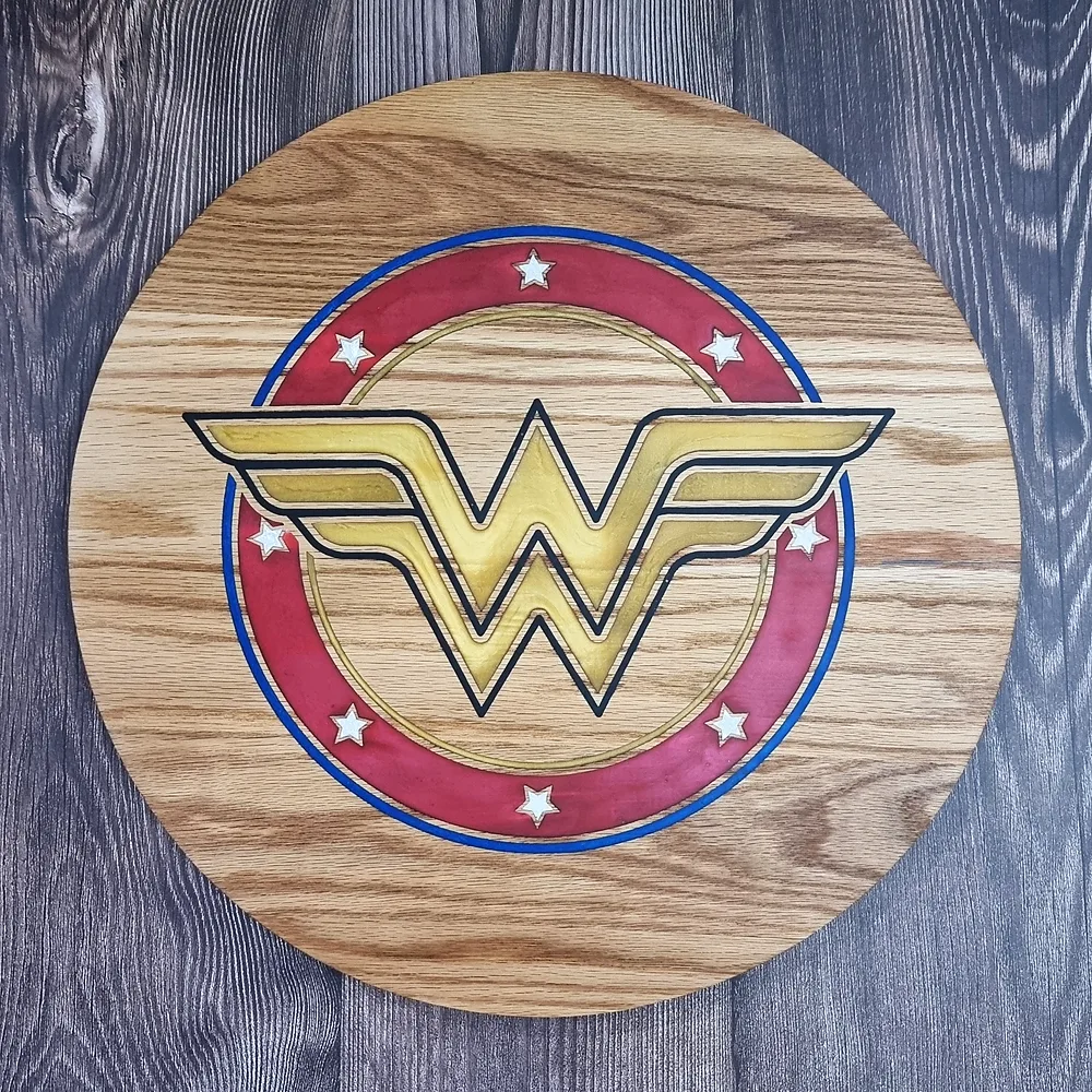 Round oak chopping board engraved with a hand-painted Wonder Woman emblem